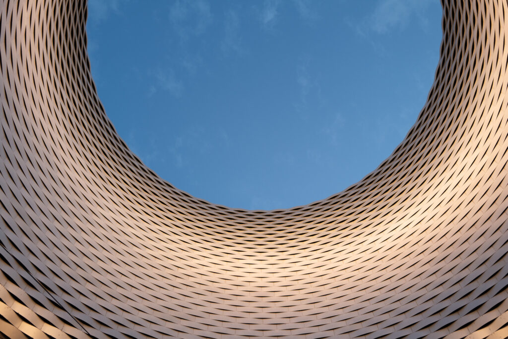 Art Basel architectural detail curved wooden slats blue sky modern design contemporary art fair venue