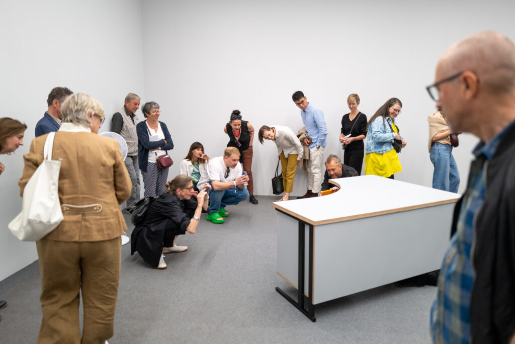 Ryan Gander School of Languages animatronic gorilla art installation Art Basel 2024 crowd viewing